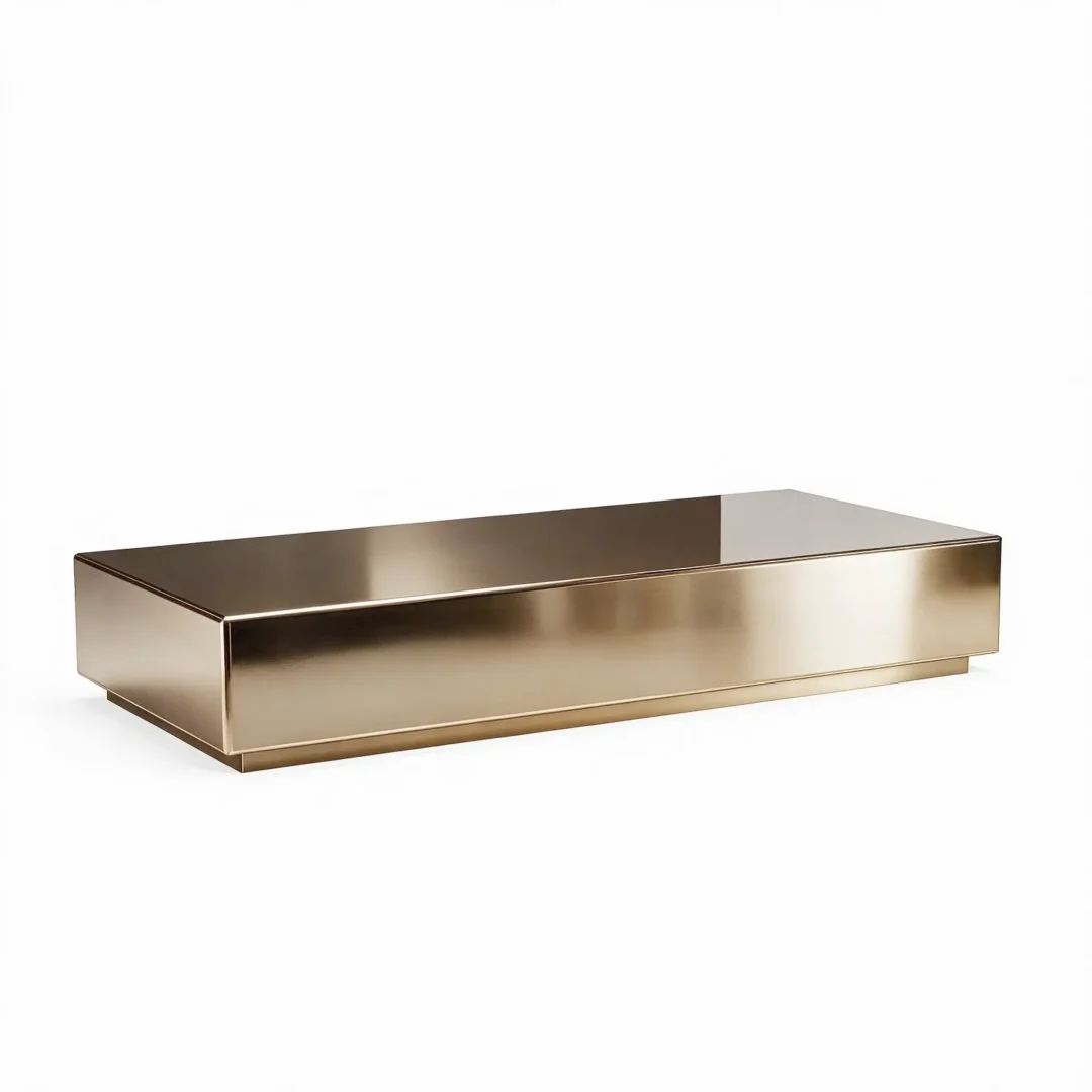 Rectangular coffee table with a low-profile geometric design, solid base, and reflective finish, shown from a front angle, ideal for Harmony Luxury Furniture collections.