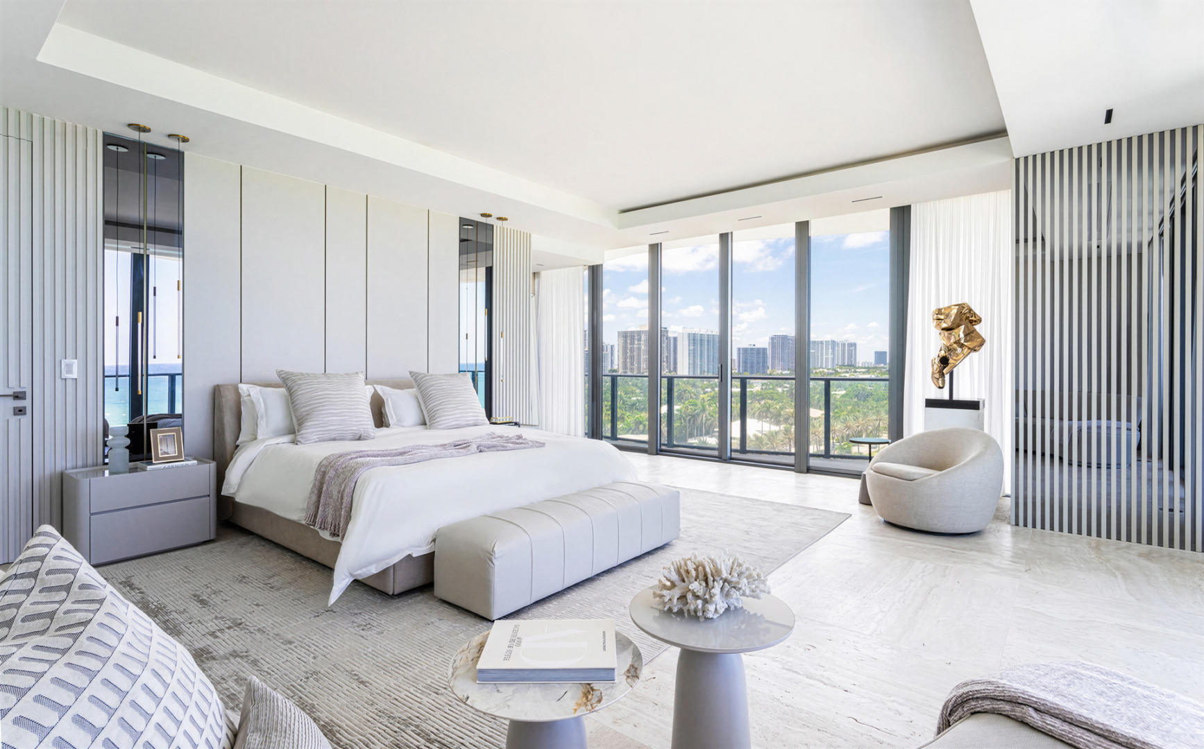 Modern luxury meets ocean views in a sophisticated, airy setting, defined by neutral tones, clean lines, and contemporary design. Regalia Residences is a project by FL Interiors, featuring Harmony Luxury Furniture.