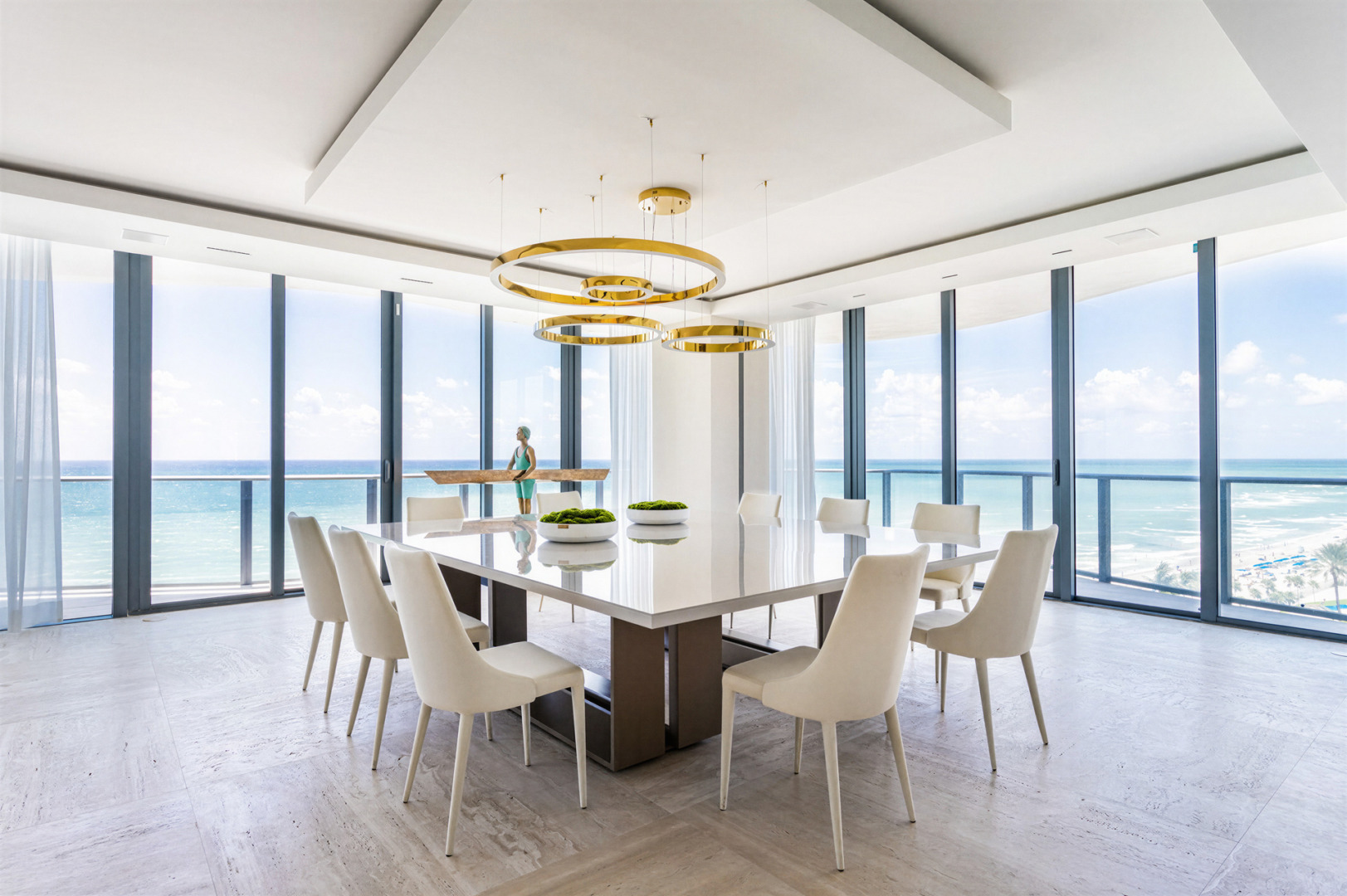 Modern luxury meets ocean views in a sophisticated, airy setting, defined by neutral tones, clean lines, and contemporary design. Regalia Residences is a project by FL Interiors, featuring Harmony Luxury Furniture.