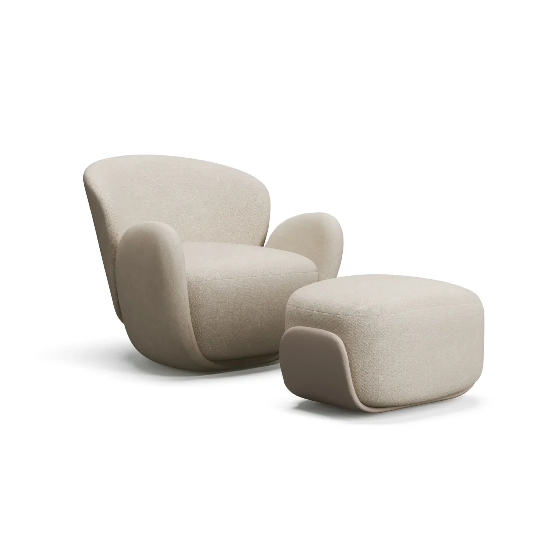 Armchair with rounded back and arms, paired with a matching rounded ottoman, both featuring a smooth, minimalist design.