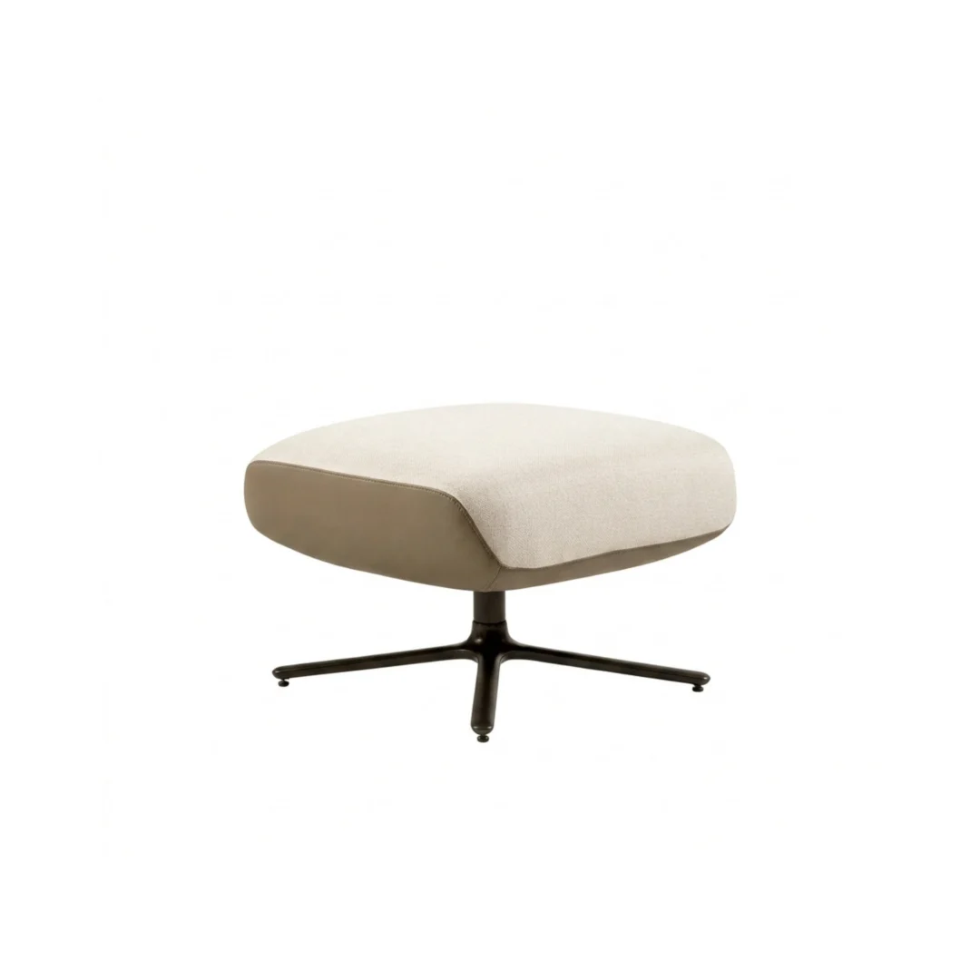 Square ottoman with rounded edges and a four-prong metal base, shown from a slightly elevated front angle.